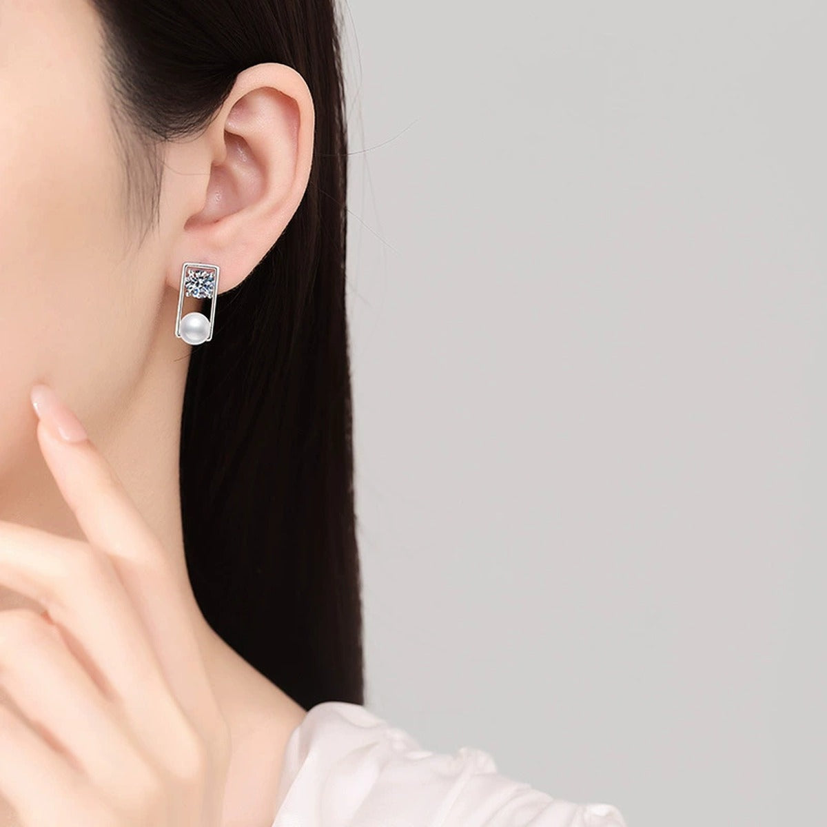 Rectangular Frame Pearl Moissanite Stud Earrings in White Gold-Plated S925 Sterling Silver worn on ear by model