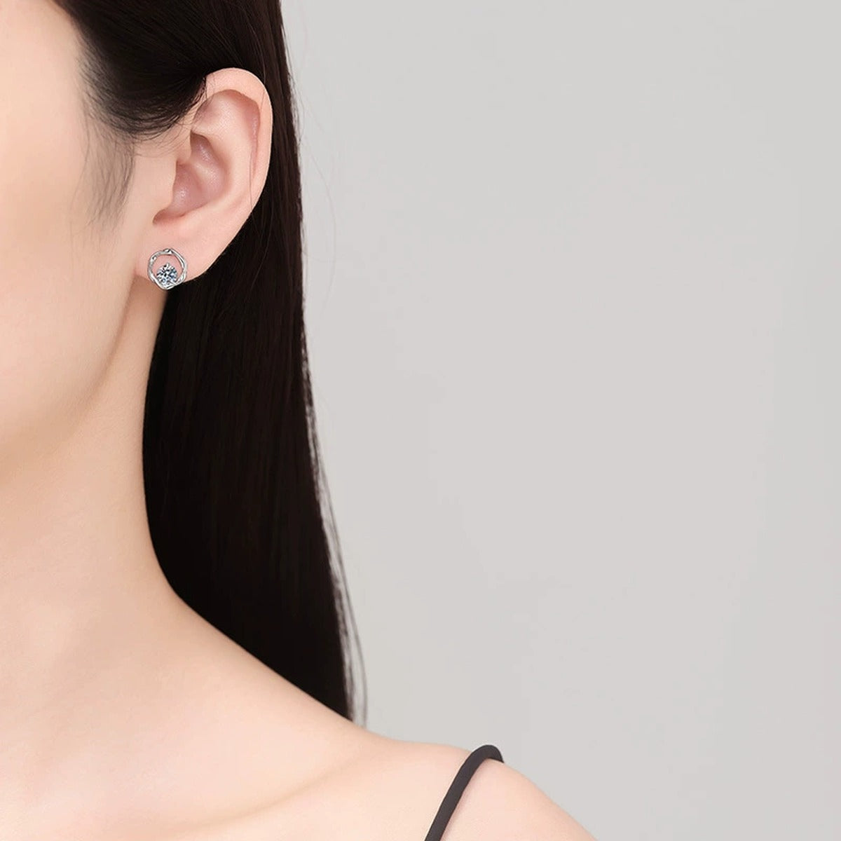 Heart Moissanite Stud Earrings in White Gold-Plated S925 Sterling Silver worn on ear by model