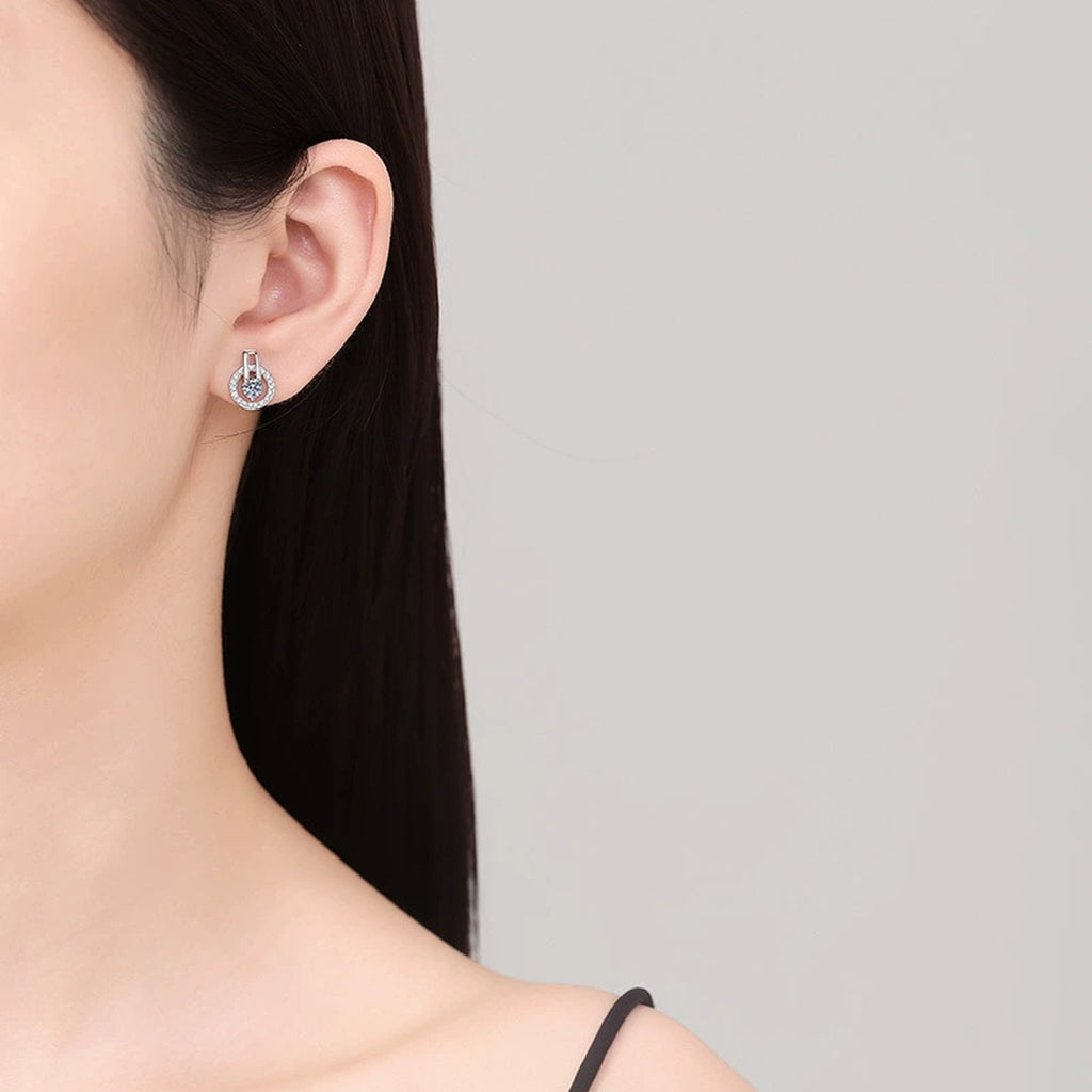 Round Moissanite Stud Earrings with CZ in White Gold-Plated S925 Silver worn on ear by model
