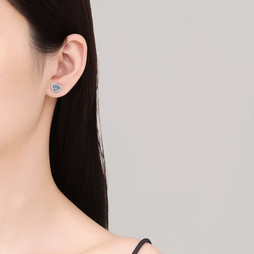 Heart Moissanite Stud Earrings with CZ in White Gold-Plated S925 Silver worn on ear by model