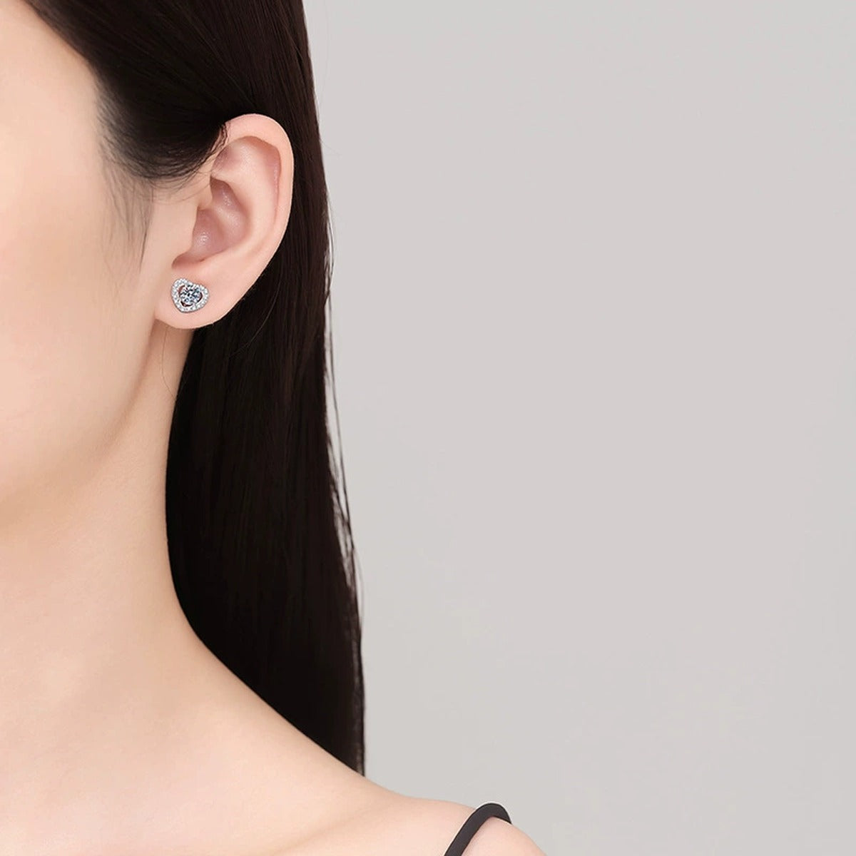 Heart Moissanite Stud Earrings with CZ in White Gold-Plated S925 Silver worn on ear by model