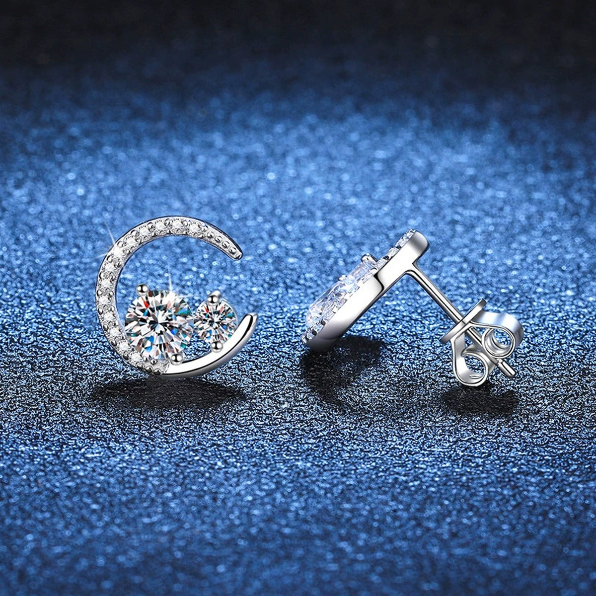 Moon Moissanite Stud Earrings with CZ in White Gold-Plated S925 Silver blue scene angled view