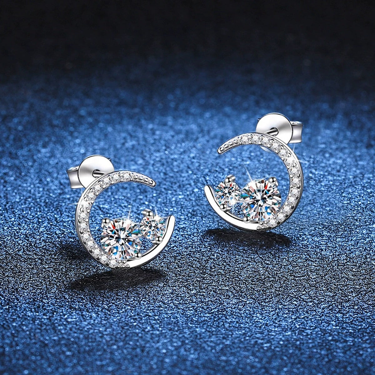 Moon Moissanite Stud Earrings with CZ in White Gold-Plated S925 Silver blue scene close-up view