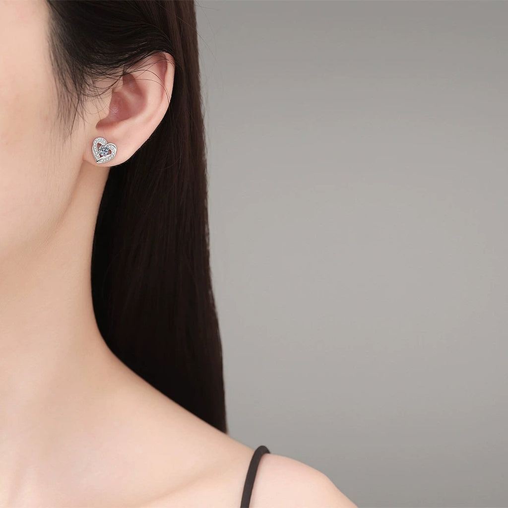 Heart Moissanite Stud Earrings with CZ in White Gold-Plated S925 Silver worn on ear by model