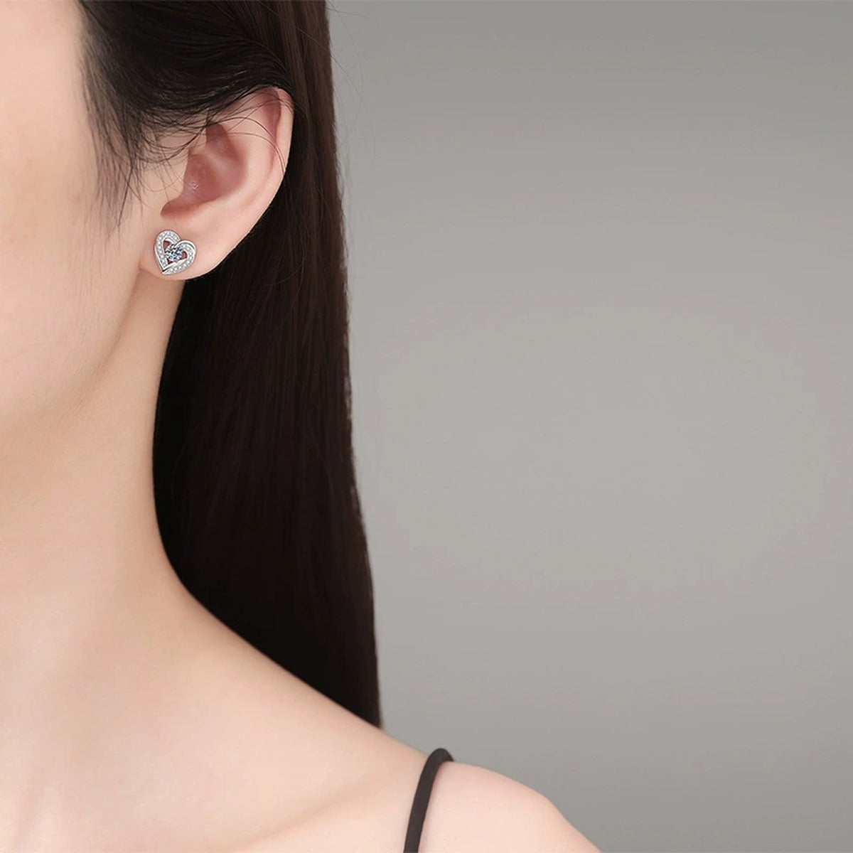 Heart Moissanite Stud Earrings with CZ in White Gold-Plated S925 Silver worn on ear by model
