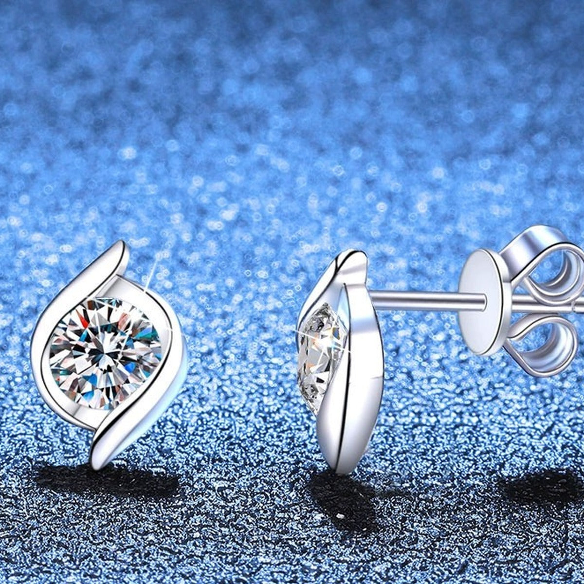 Pear Moissanite Stud Earrings in Gold-Plated S925 Sterling Silver blue scene angled view