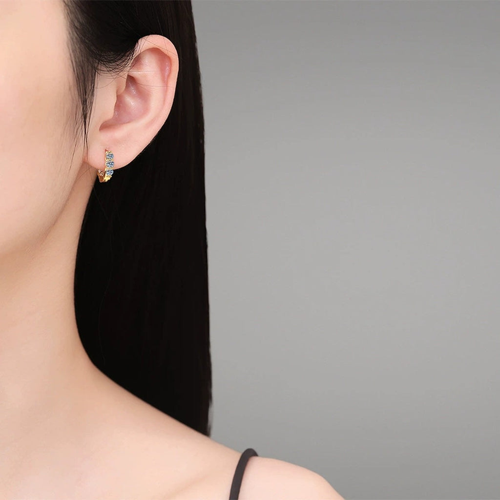 Oval Cluster Moissanite Hoop Earrings in Gold-Plated S925 Silver worn on ear by model