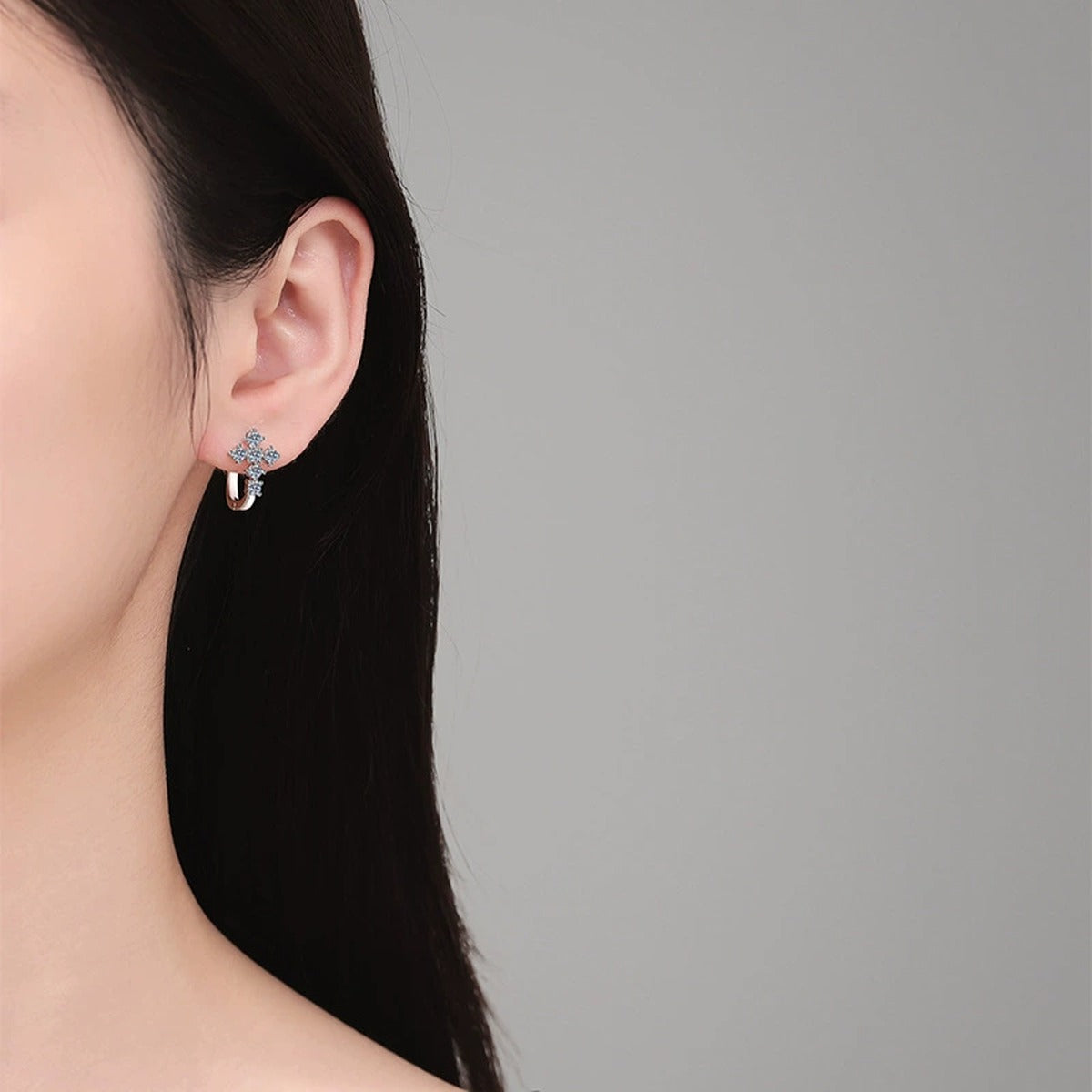 Moon Moissanite Stud Earrings in White Gold-Plated S925 Sterling Silver worn on ear by model