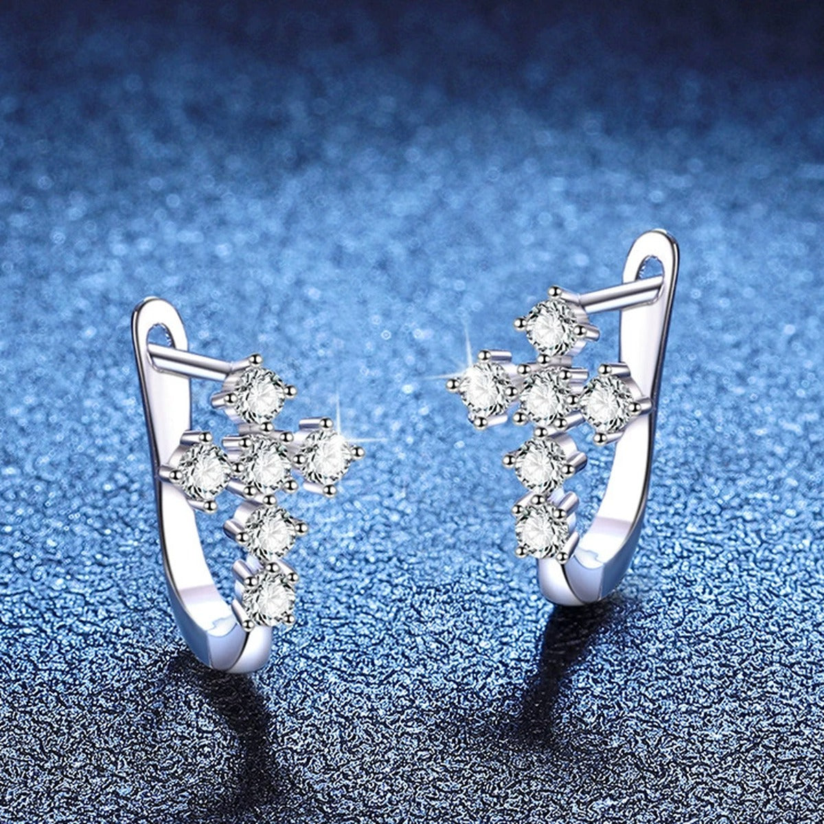 Moon Moissanite Stud Earrings in White Gold-Plated S925 Sterling Silver blue scene angled view