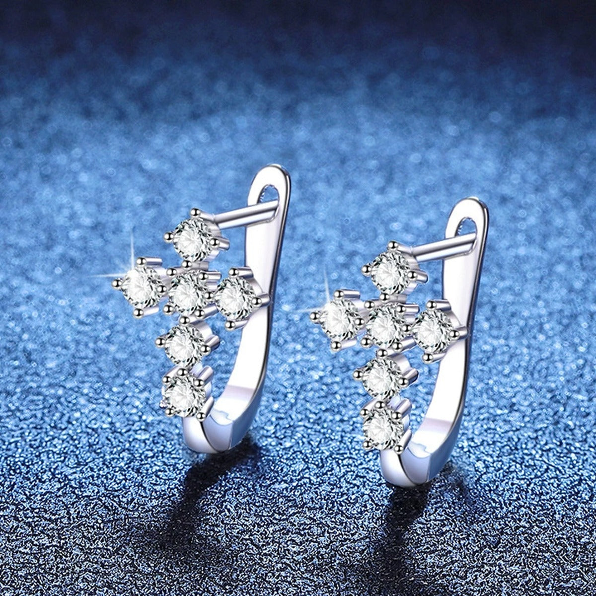 Moon Moissanite Stud Earrings in White Gold-Plated S925 Sterling Silver blue scene close-up view
