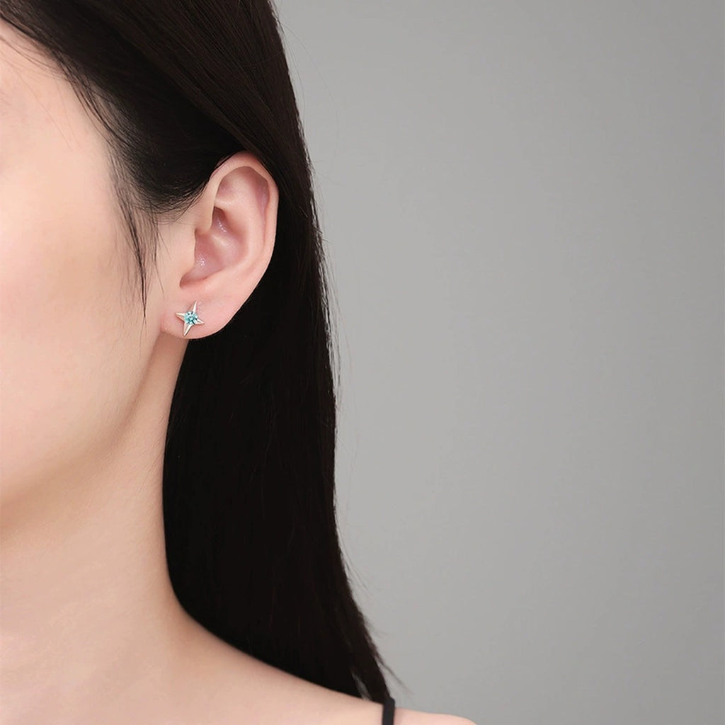 Green Moissanite Stud Earrings in White Gold-Plated S925 Silver worn on ear by model