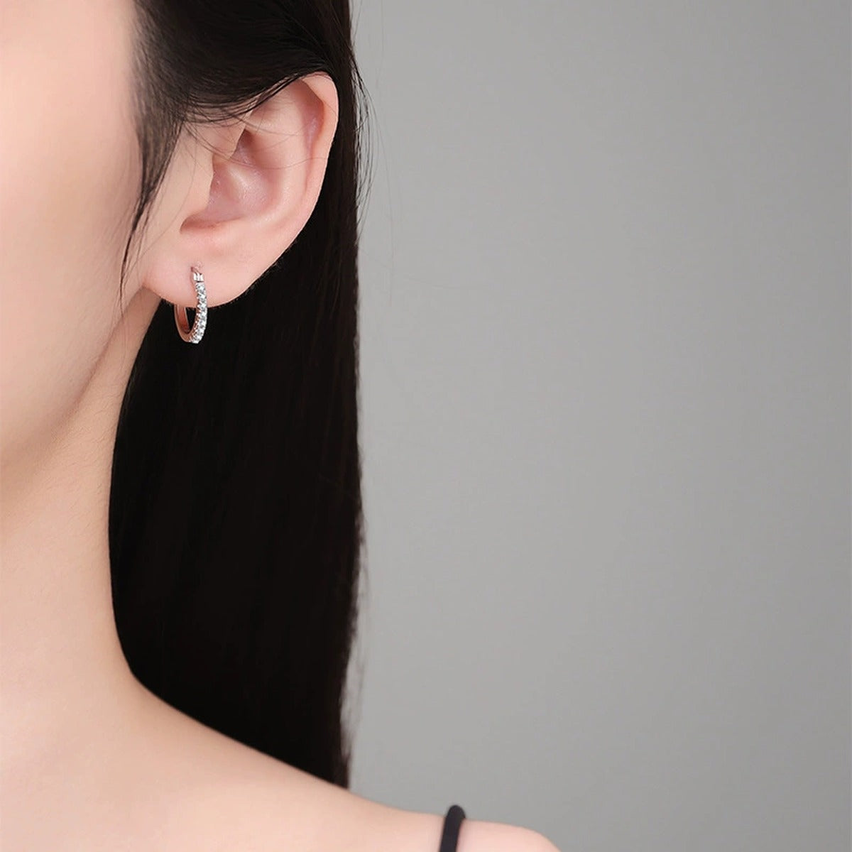 Pave Moissanite Hoop Earrings in White Gold-Plated S925 Sterling Silver worn on ear by model
