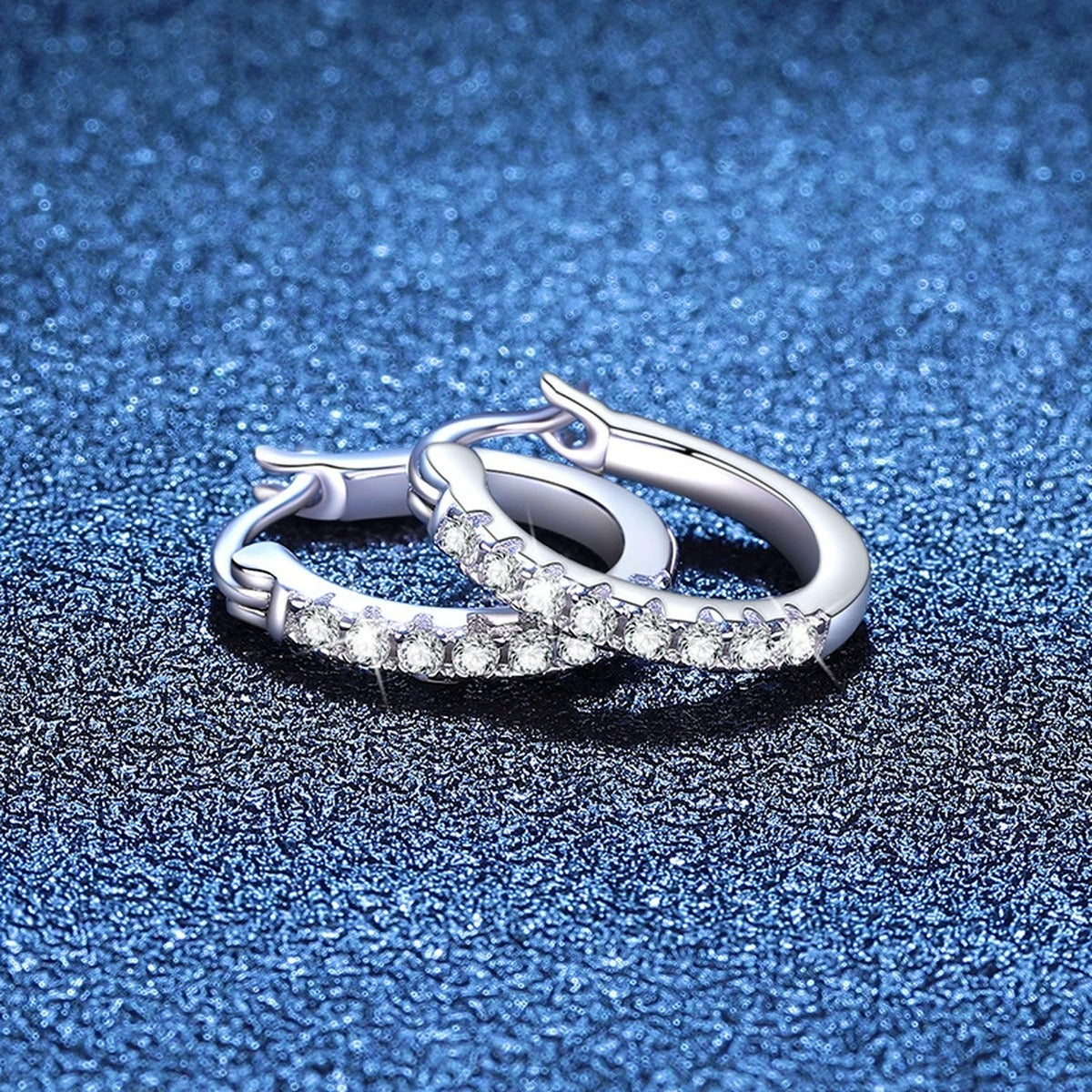 Pave Moissanite Hoop Earrings in White Gold-Plated S925 Sterling Silver blue scene close-up view
