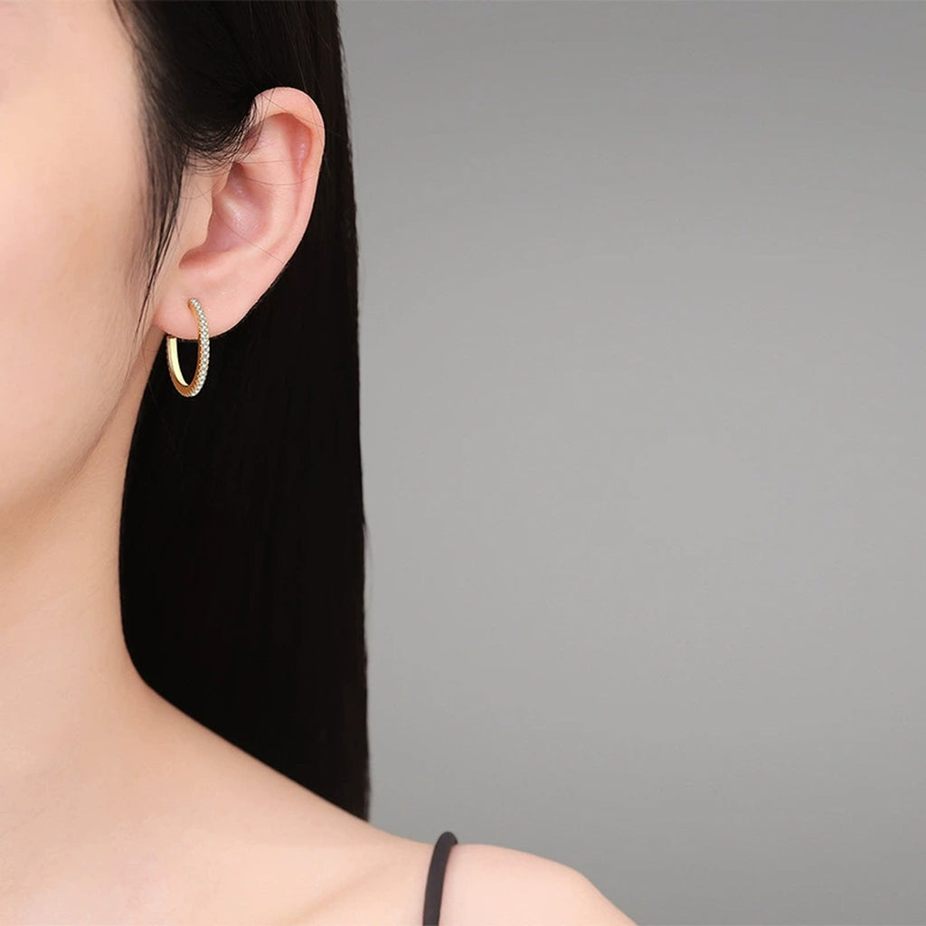 Pave Moissanite Hoop Earrings in Yellow Gold-Plated S925 Silver worn on ear by model