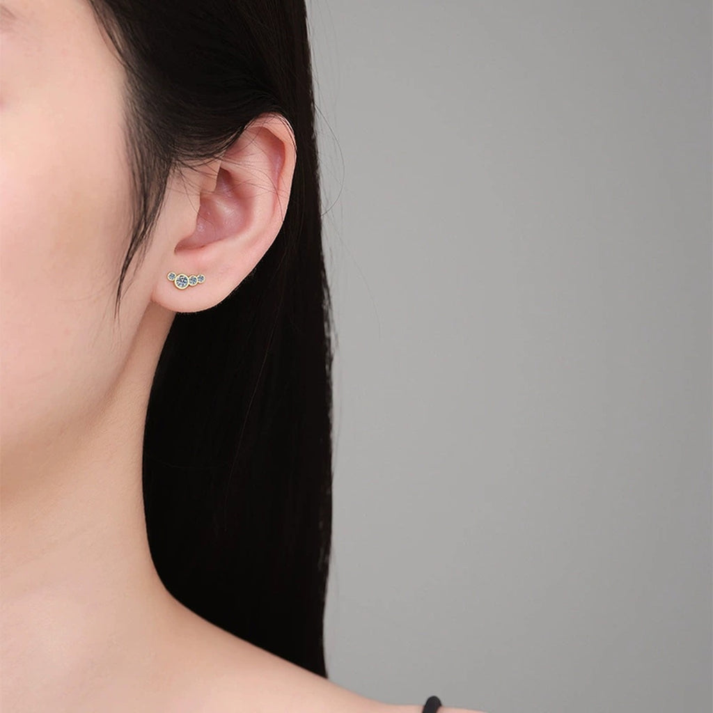 Floral Moissanite Stud Earrings in Yellow Gold-Plated S925 Silver worn on ear by model