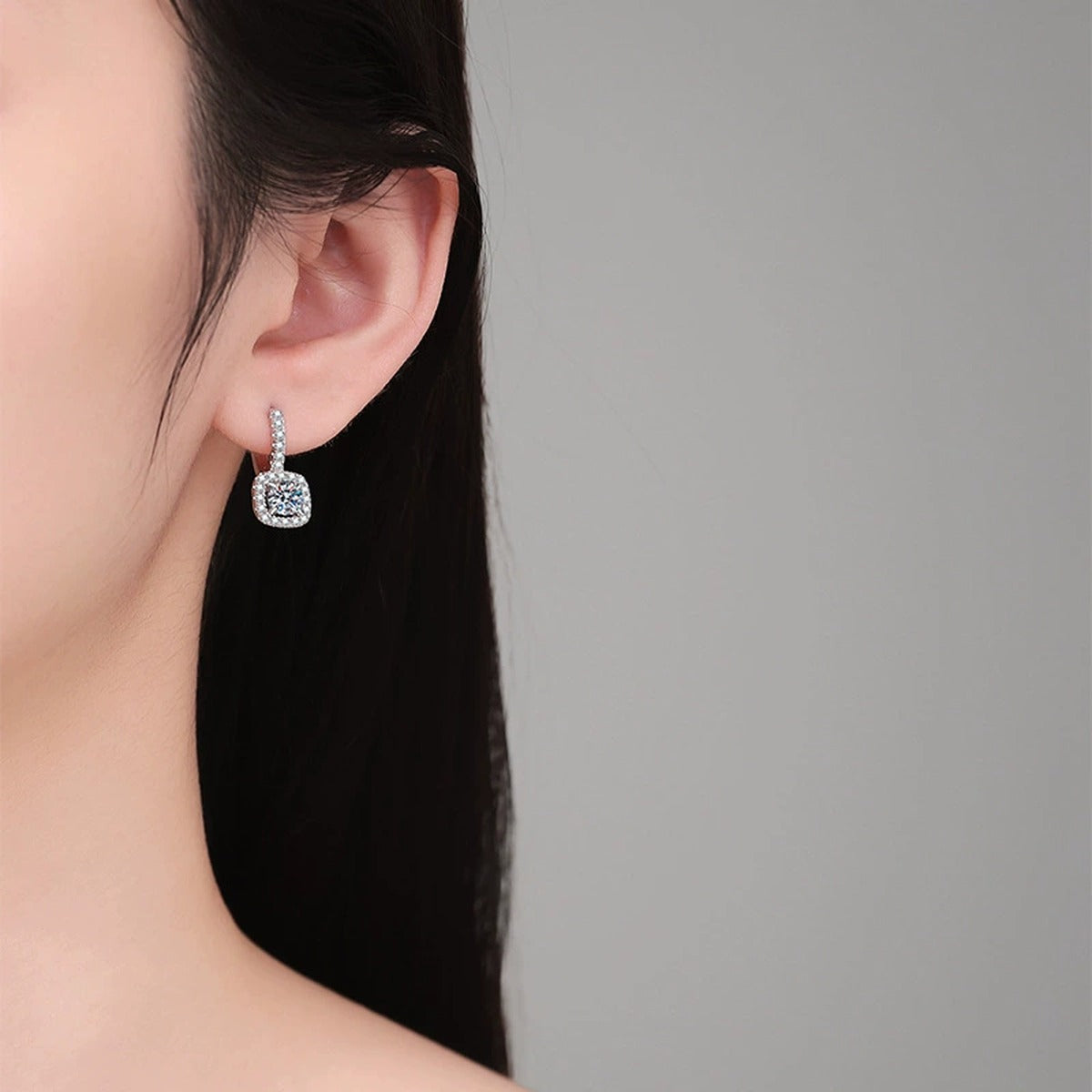 Cushion Halo Moissanite Hoop Drop Earrings with CZ in White Gold-Plated S925 Sterling Silver worn on ear by model