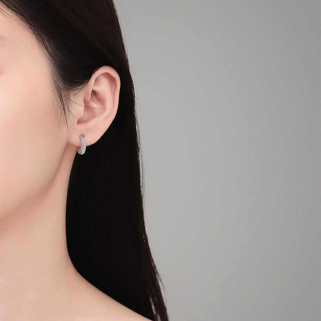 Pave Moissanite Hoop Earrings in White Gold-Plated S925 Sterling Silver worn on ear by model