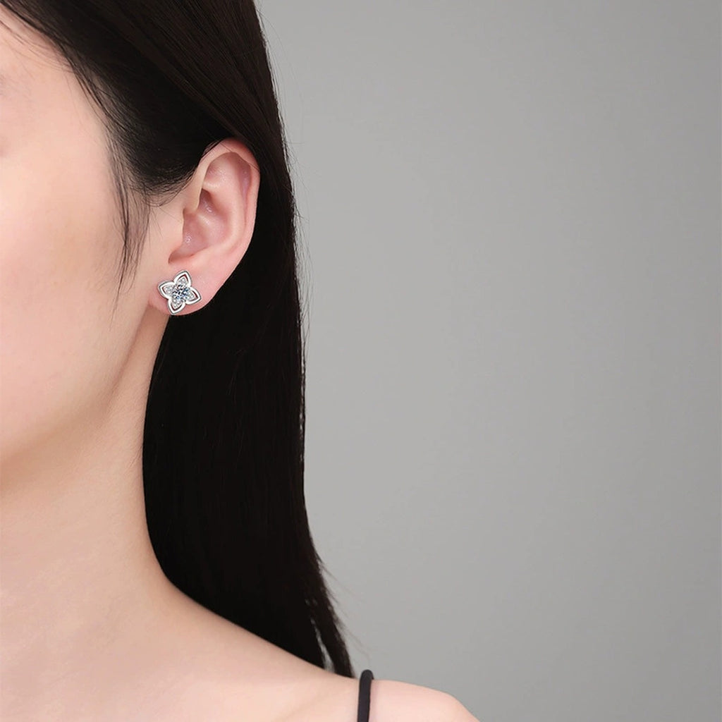 Four-Petal Moissanite Stud Earrings with CZ in White Gold-Plated S925 Sterling Silver worn on ear by model