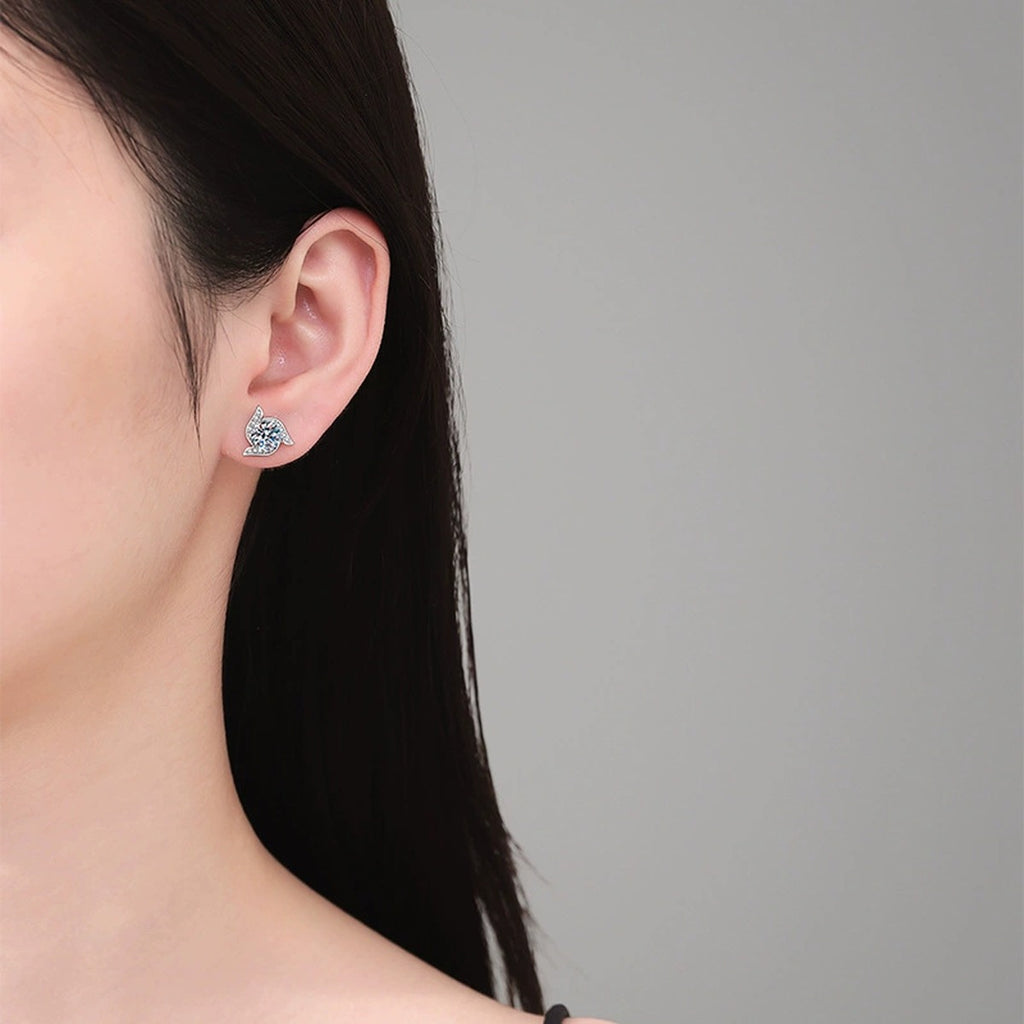 Model wearing platinum-plated S925 sterling silver leaf moissanite stud earrings