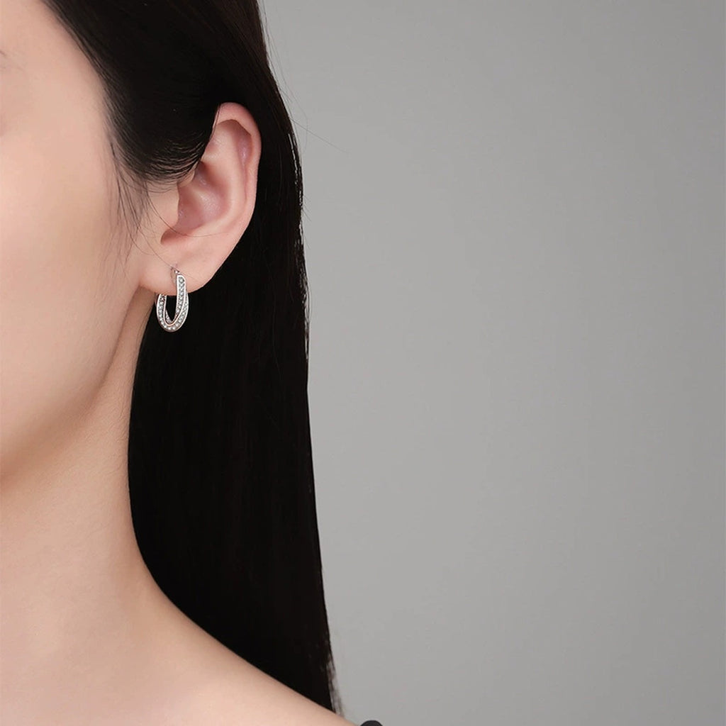 Twist Pave Moissanite Hoop Earrings in White Gold-Plated S925 Sterling Silver worn on ear by model