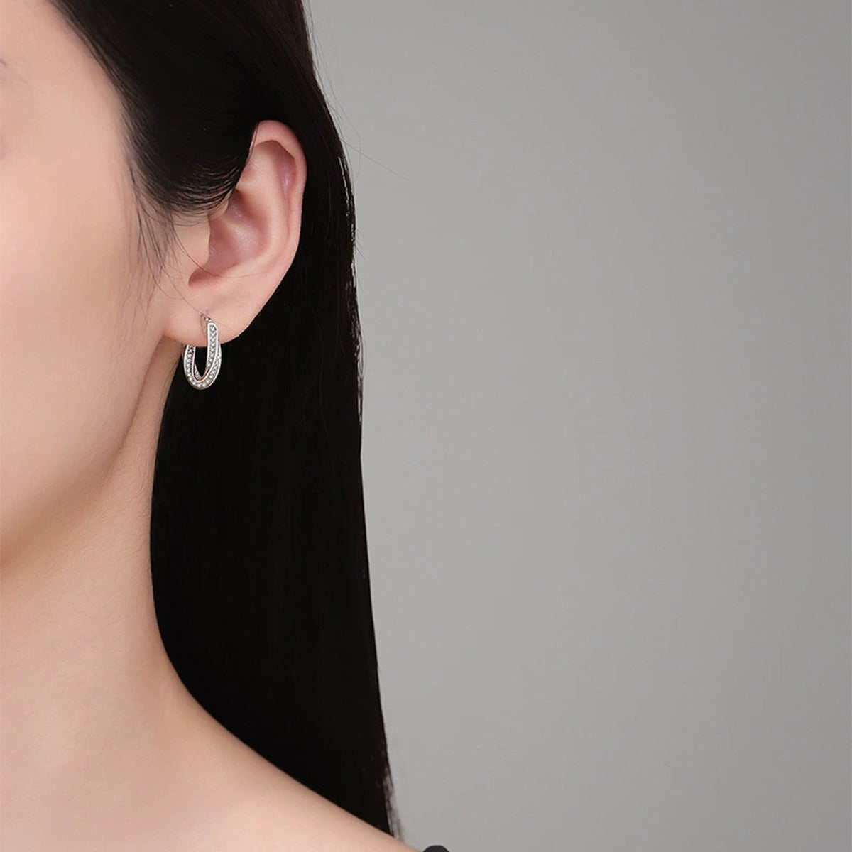 Twist Pave Moissanite Hoop Earrings in White Gold-Plated S925 Sterling Silver worn on ear by model