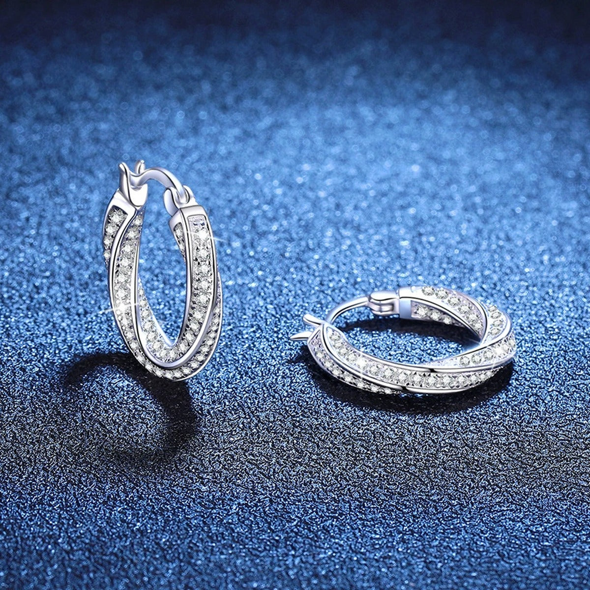 Twist Pave Moissanite Hoop Earrings in White Gold-Plated S925 Sterling Silver blue scene close-up view