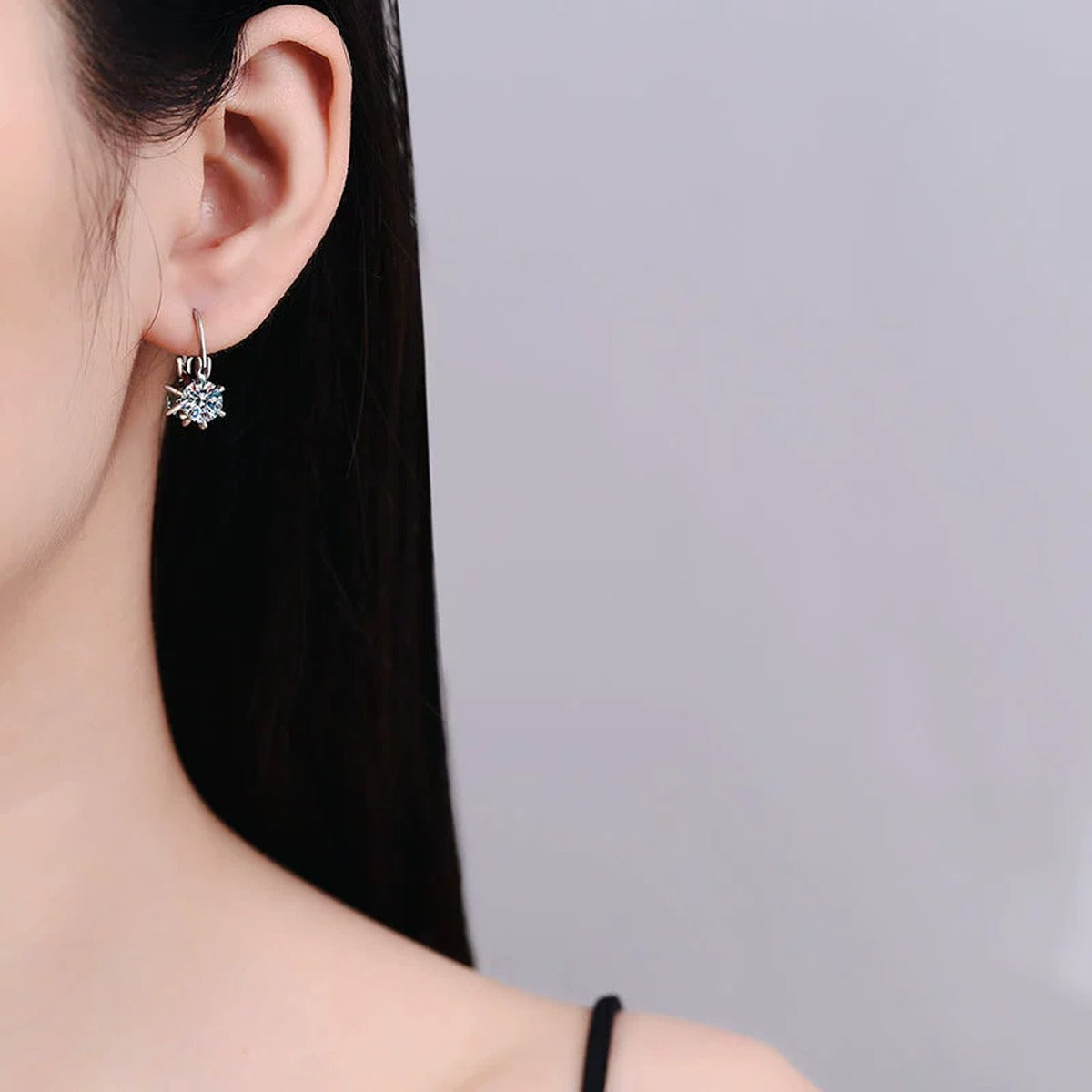 Green and White Moissanite Star Drop Earrings with CZ in White Gold-Plated S925 Sterling Silver worn on ear by model
