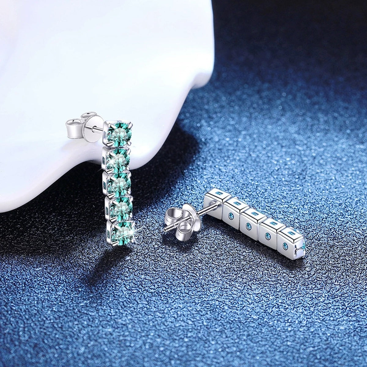 Green Stone Bar Stud Earrings in White Gold-Plated S925 Sterling Silver blue scene angled view