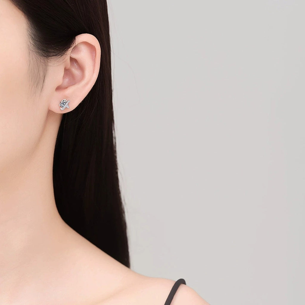 Star Moissanite Stud Earrings with CZ in White Gold-Plated S925 Sterling Silver worn on ear by model