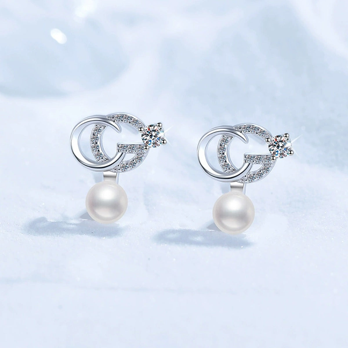 Crescent Pearl Moissanite Stud Drop Earrings with CZ in White Gold-Plated S925 Sterling Silver blue scene angled view