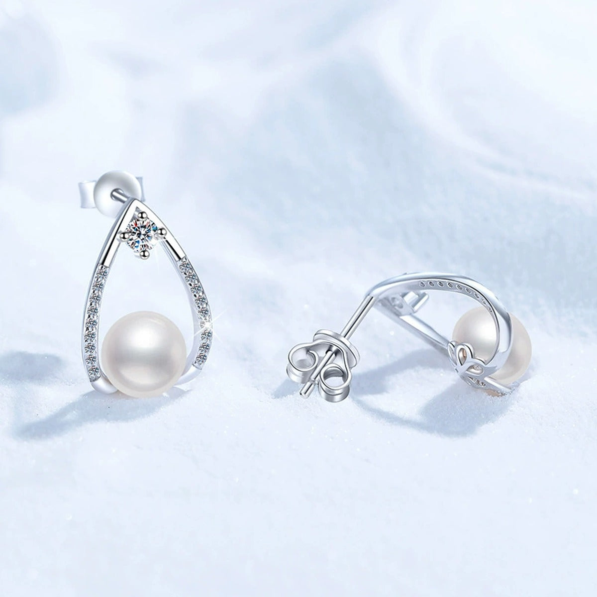 Pear-Shaped Pearl Moissanite Stud Earrings with CZ in White Gold-Plated S925 Sterling Silver close-up product detail view