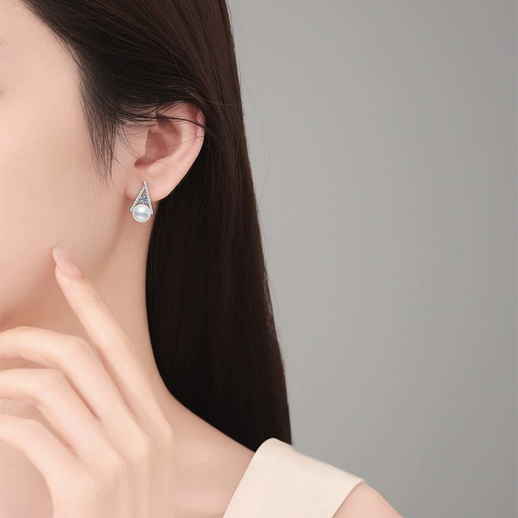 Triangle Pearl Moissanite Stud Earrings with CZ in White Gold-Plated S925 Sterling Silver worn on ear by model