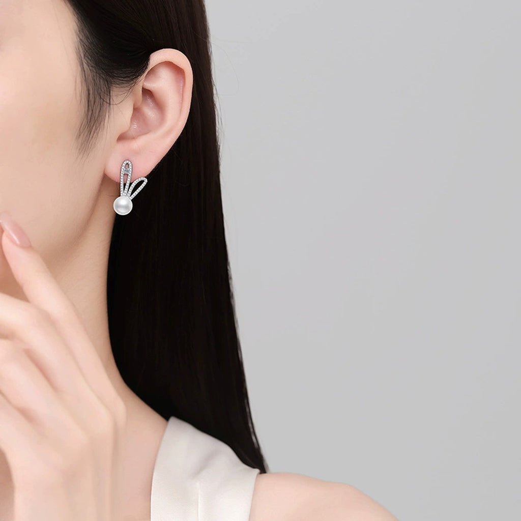 Bunny Pearl Moissanite Stud Drop Earrings with CZ in White Gold-Plated S925 Sterling Silver worn on ear by model