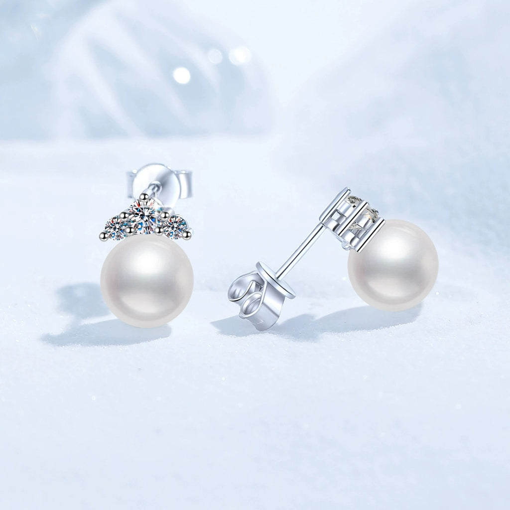 Crown Pearl Moissanite Stud Earrings in White Gold-Plated S925 Sterling Silver blue scene angled view