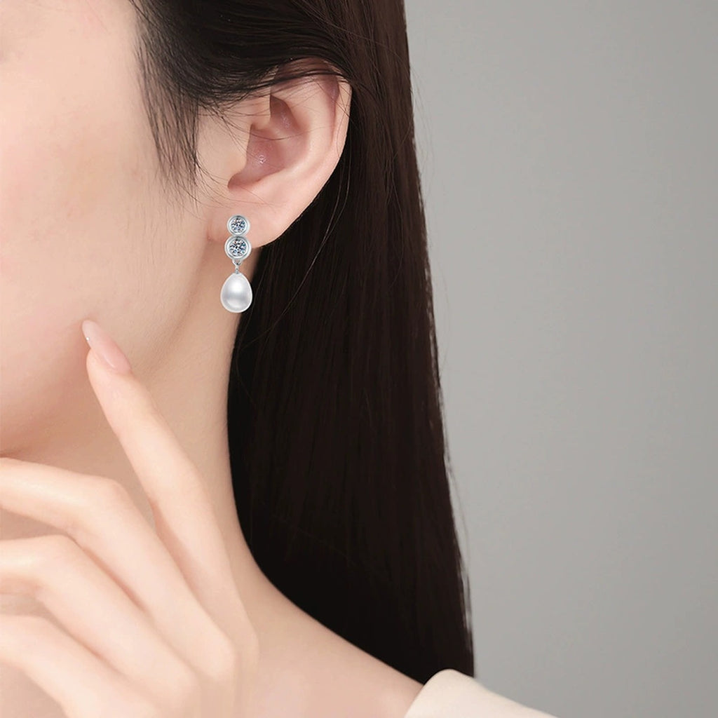 Triple-Stone Pearl Moissanite Stud Drop Earrings in White Gold-Plated S925 Sterling Silver worn on ear by model