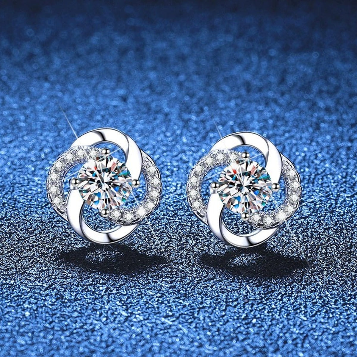 Swirl Moissanite Stud Earrings with CZ in White Gold-Plated S925 Sterling Silver blue scene close-up view