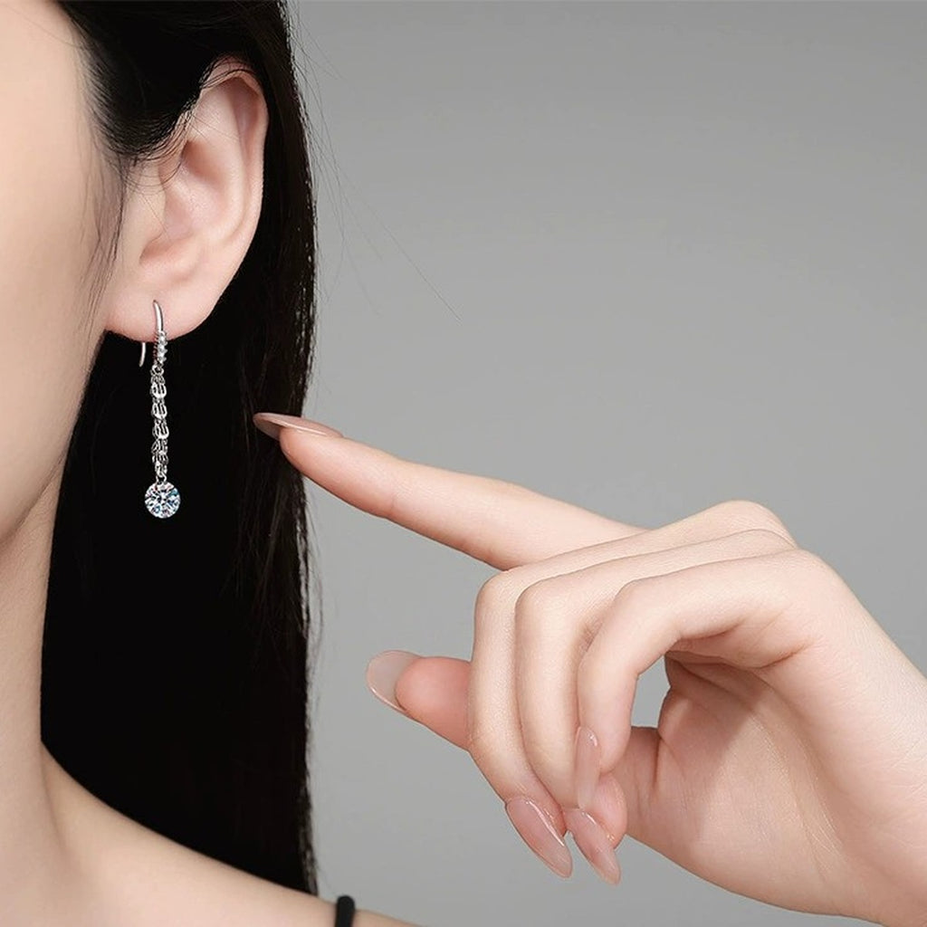 Round Moissanite Chain Drop Earrings in White Gold-Plated S925 Sterling Silver worn on ear by model