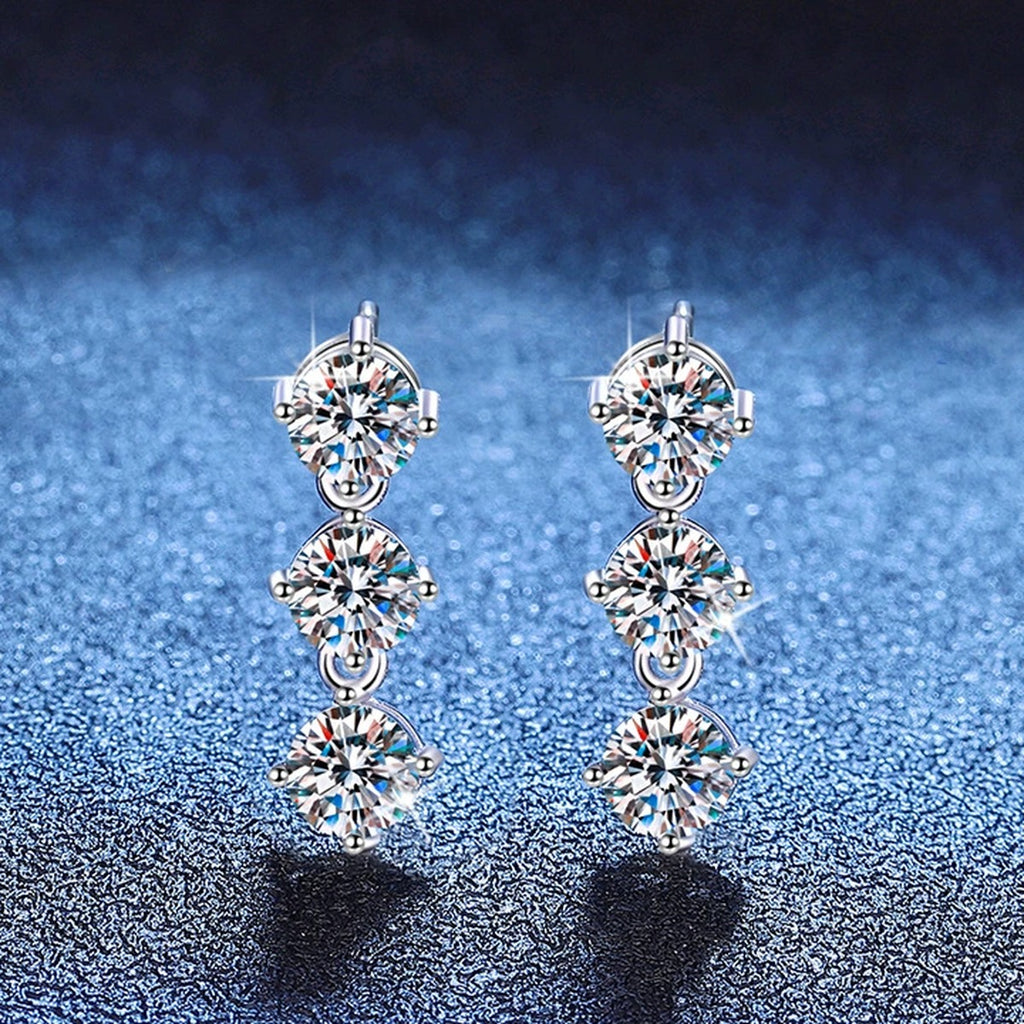 Three-Stone Moissanite Stud Earrings in White Gold-Plated S925 Sterling Silver blue scene angled view