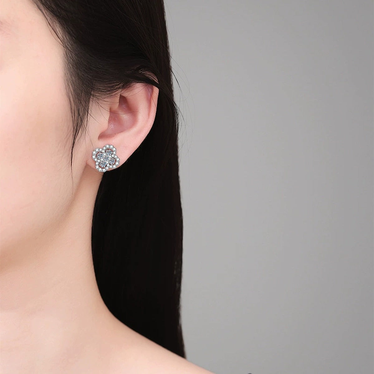 Clover Cluster Moissanite Stud Earrings with CZ in White Gold-Plated S925 Sterling Silver worn on ear by model