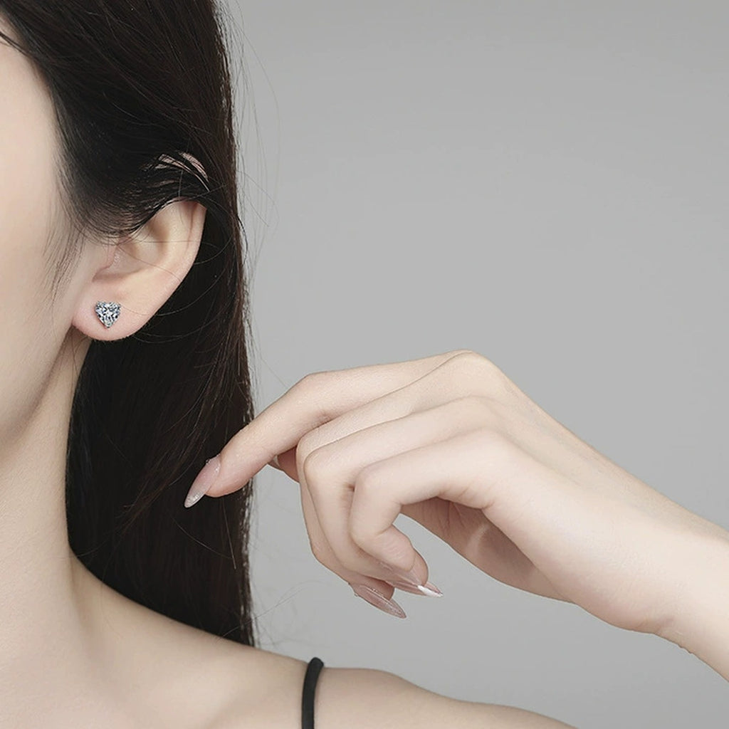 Heart Moissanite Stud Earrings in White Gold-Plated S925 Sterling Silver worn on ear by model