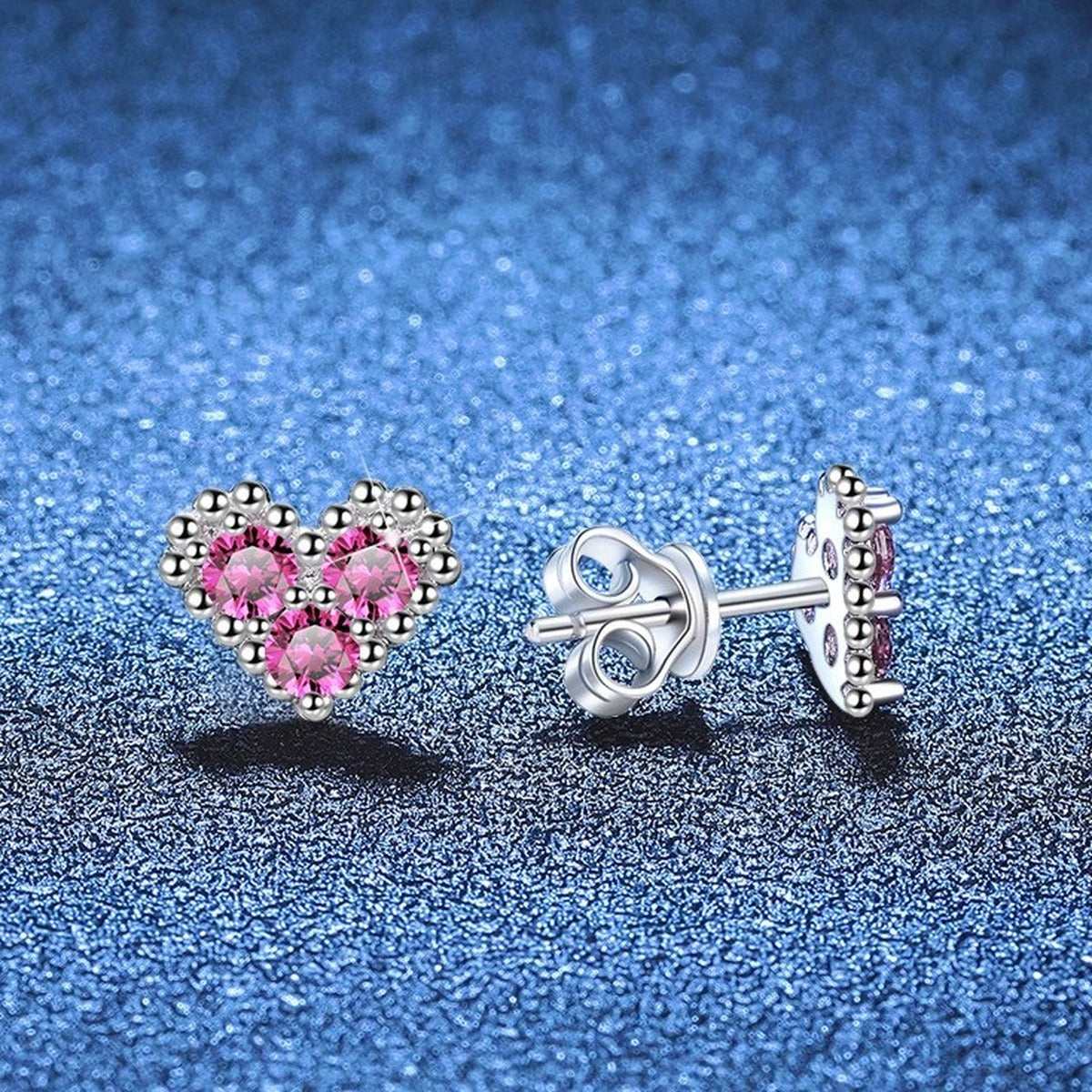 Heart Moissanite Stud Earrings in White Gold-Plated S925 Sterling Silver blue scene close-up view