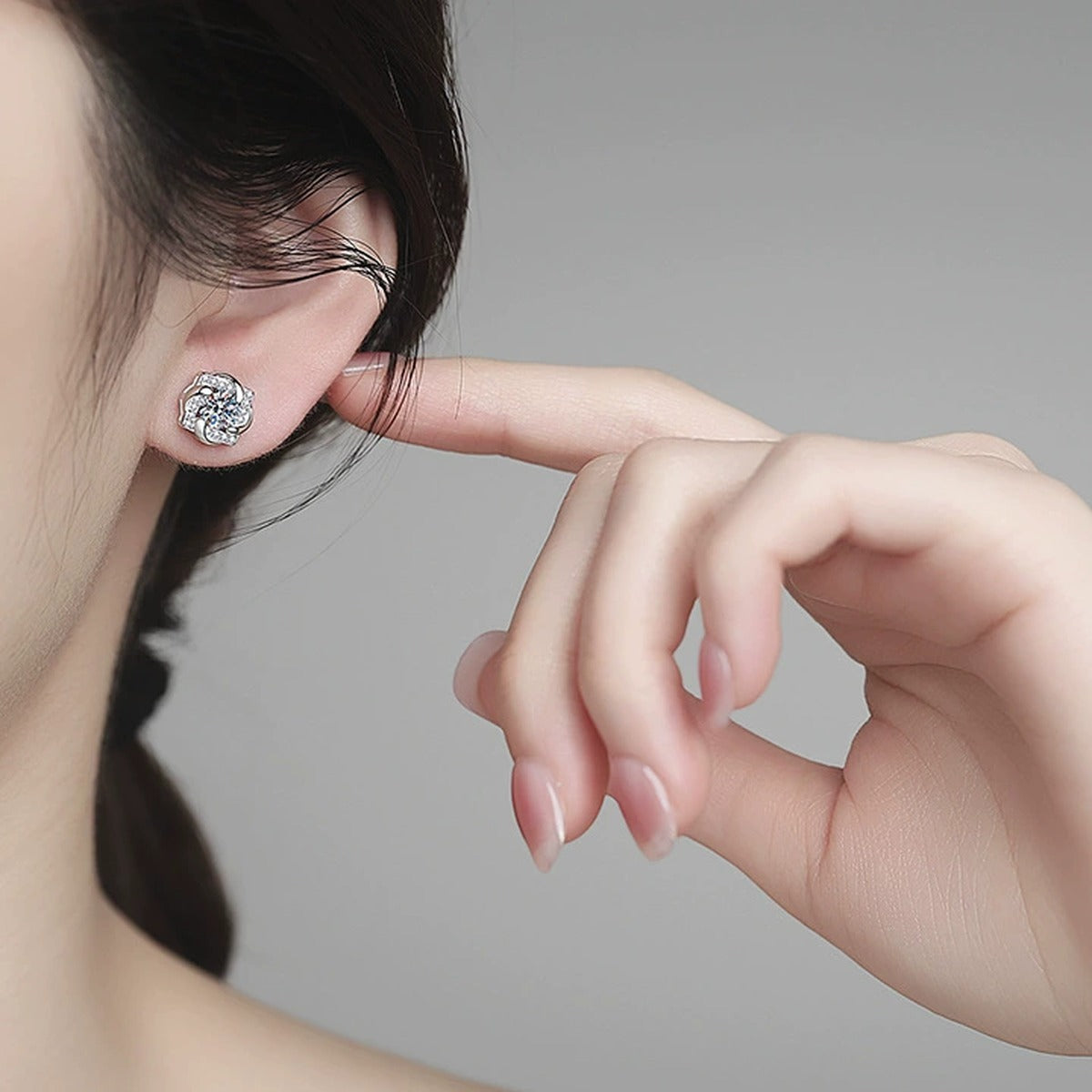 Floral Moissanite Stud Earrings with CZ in White Gold-Plated S925 Sterling Silver worn on ear by model