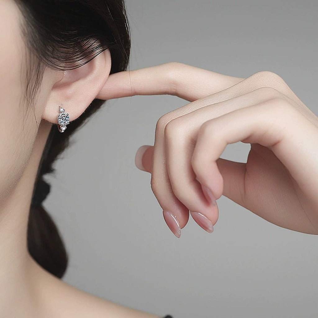 Three-Stone Moissanite Hoop Earrings with CZ in White Gold-Plated S925 worn on ear by model