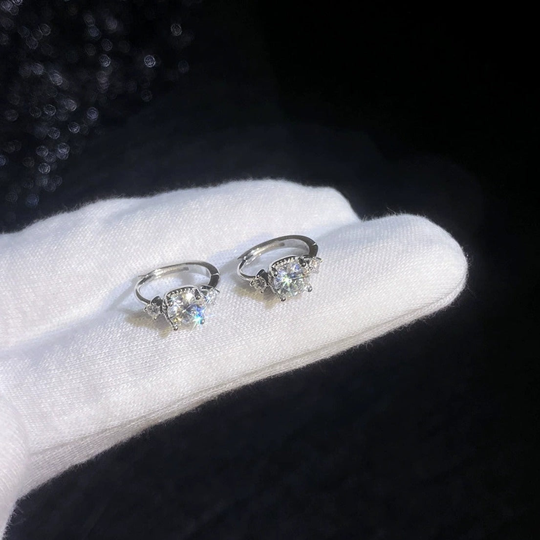 Three-Stone Moissanite Hoop Earrings with CZ in White Gold-Plated S925 dark background product display view