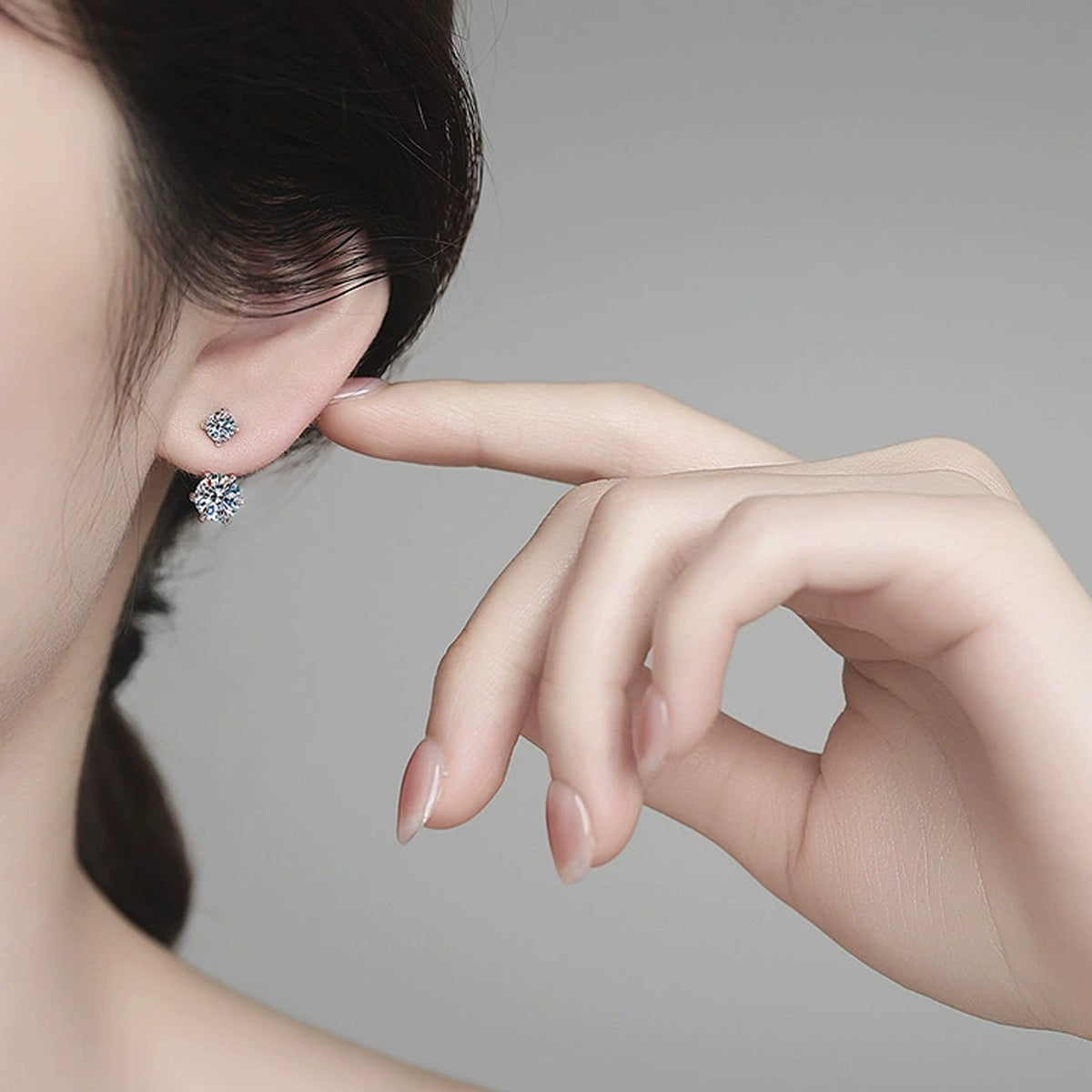 Two-Stone Moissanite Drop Earrings in White Gold-Plated S925 Sterling Silver worn on ear by model