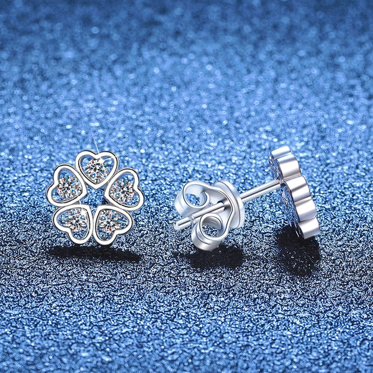 Five-Petal Moissanite Stud Earrings in White Gold-Plated S925 Sterling Silver blue scene angled view