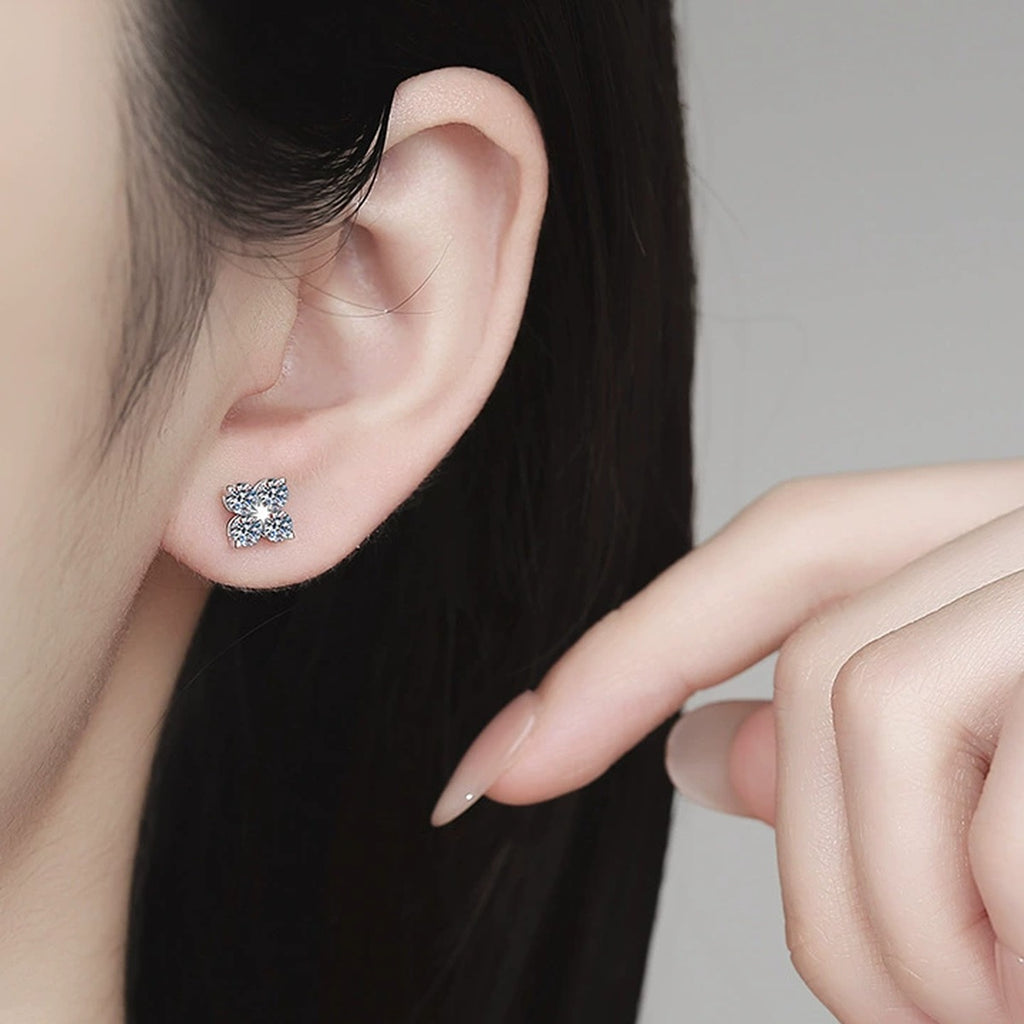Star Moissanite Stud Earrings in White Gold-Plated S925 Sterling Silver worn on ear by model