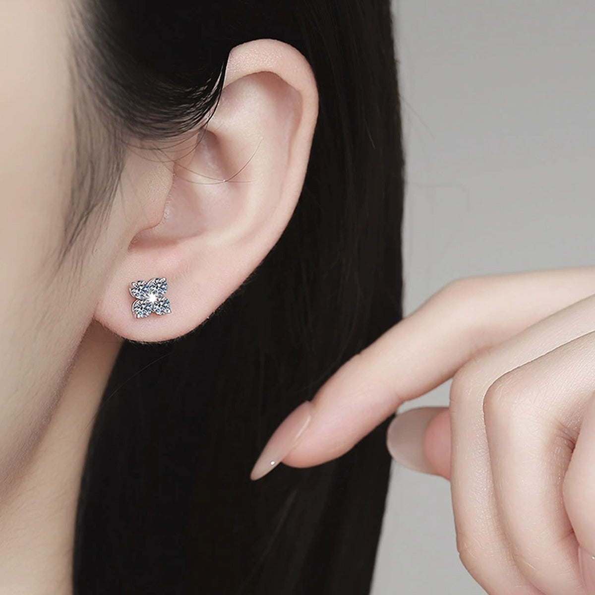 Star Moissanite Stud Earrings in White Gold-Plated S925 Sterling Silver worn on ear by model