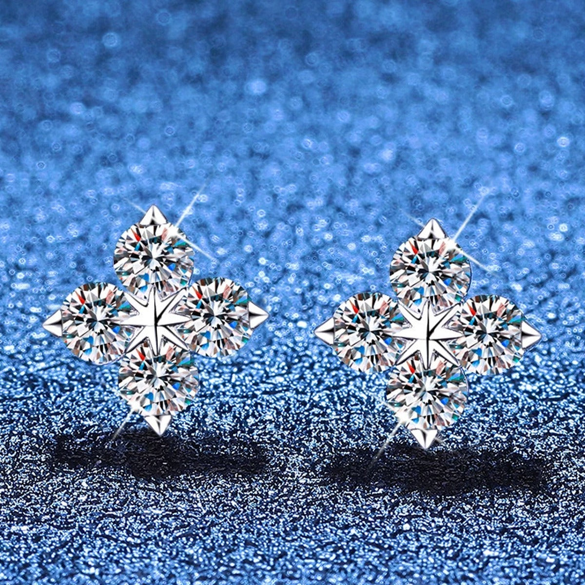 Star Moissanite Stud Earrings in White Gold-Plated S925 Sterling Silver blue scene angled view