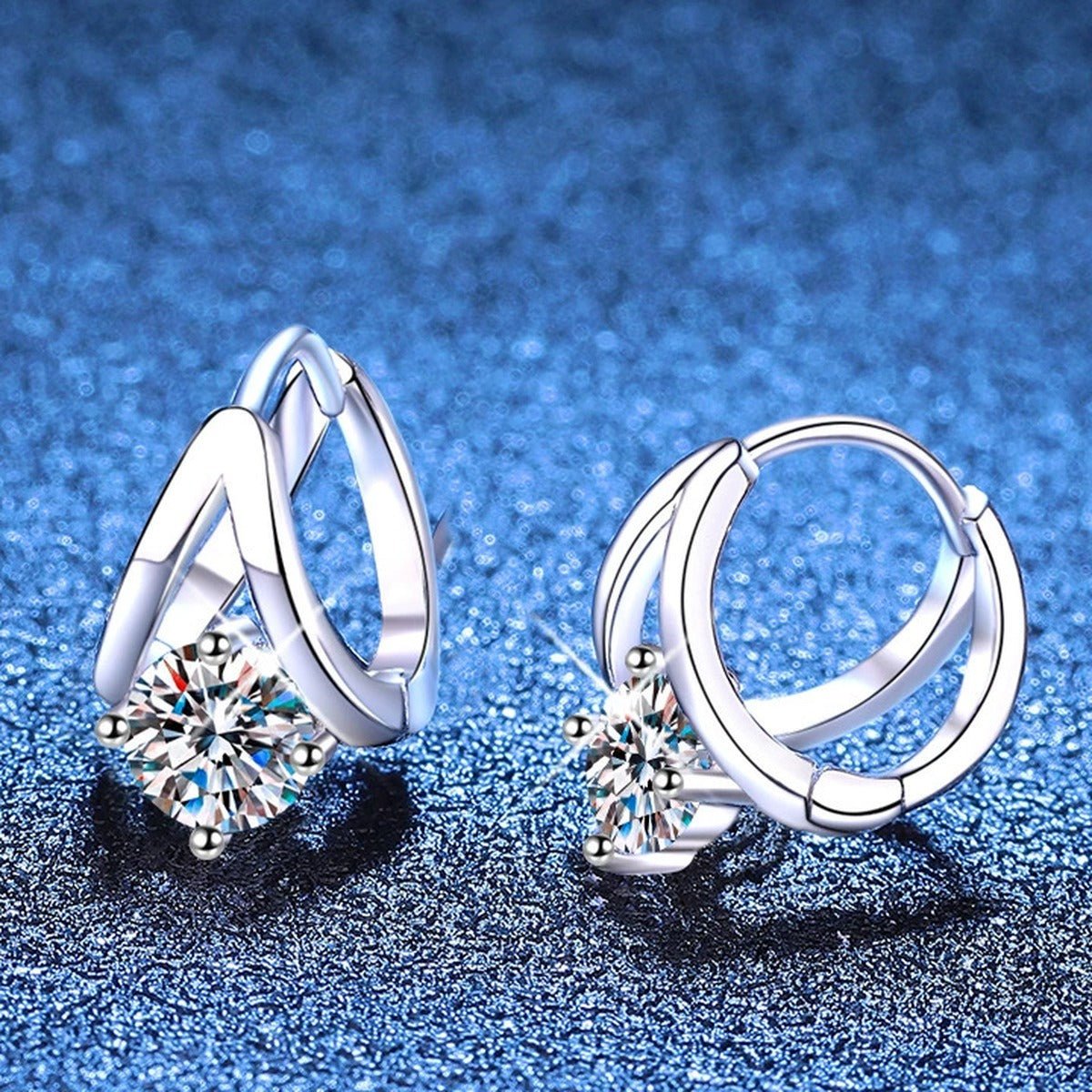 Round Moissanite Huggie Hoop Earrings in White Gold-Plated S925 Sterling Silver blue scene angled view